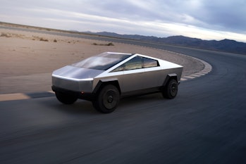 Tesla Cybertruck driving around a track.