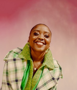 Quinta Brunson in a Tanya Taylor coat, sweater, and skirt and Jennifer Fisher earrings
