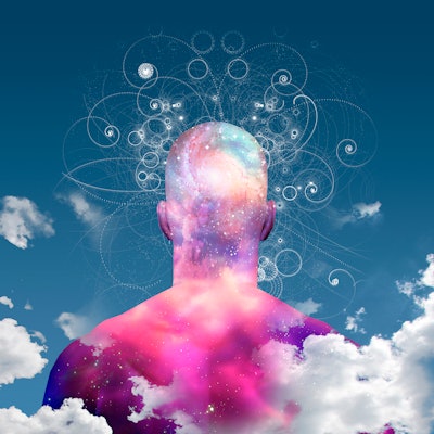 man with clouds and galaxy background