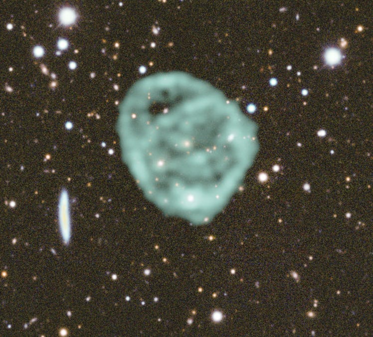 Data from SARAO's MeerKAT radio telescope data (green) showing the odd radio circles, is overlaid on...