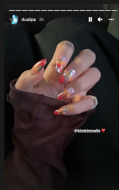 Dua Lipa trippy orange red silver nails