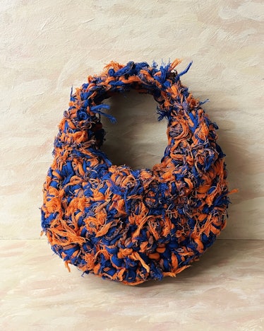 2022 handbag trends unexpected textures blue and orange crochet bag made with recycled jersey yarn