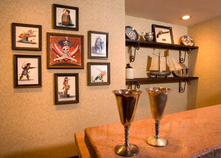 Disney's Pirates of the Caribbean suite includes a wet bar with art from the Disneyland ride. 