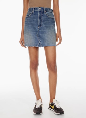 Aritzia's Denim Forum The Debbie Denim Mini Skirt is a spring 2022 essential.