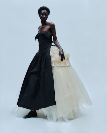 A model wearing a gown by Ashlyn