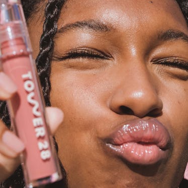Model wearing Tower 28's Dream Team Best Seller Lip + Cheek Set with the Tinted Balm and Lip Jelly.