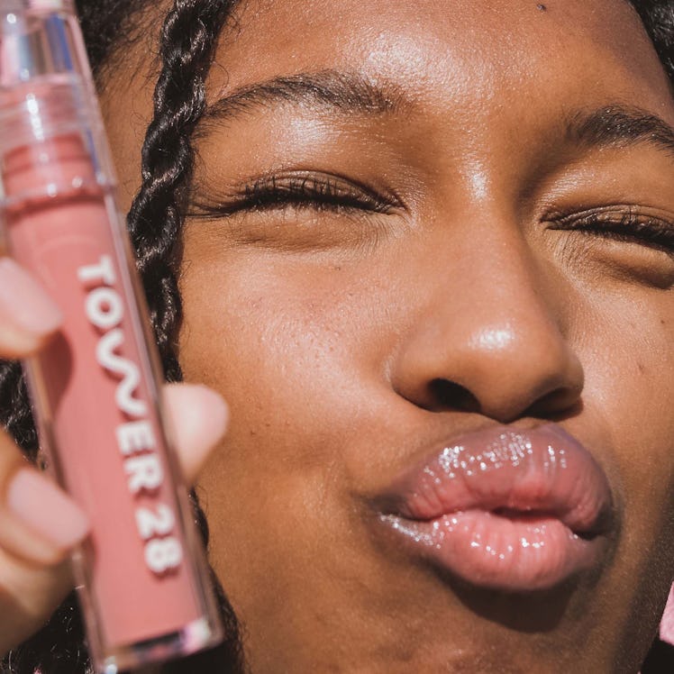 Model wearing Tower 28's Dream Team Best Seller Lip + Cheek Set with the Tinted Balm and Lip Jelly.