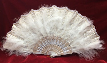 This hand fan is an example of Bridgerton home decor.