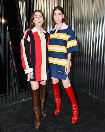 Alana and Danielle Haim wearing looks from Louis Vuitton’s fall 2022 collection.