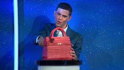 Host Mikey Day cutting into a purse cake in episode 2 of 'Is it Cake?' via Netflix's press site