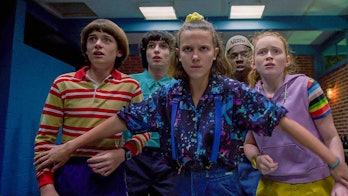 Eleven standing with her friends in Stranger Things Season 3