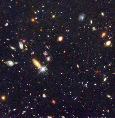 The image shows a central portion of the Hubble Deep Field, created from exposures taken in 1995. Th...