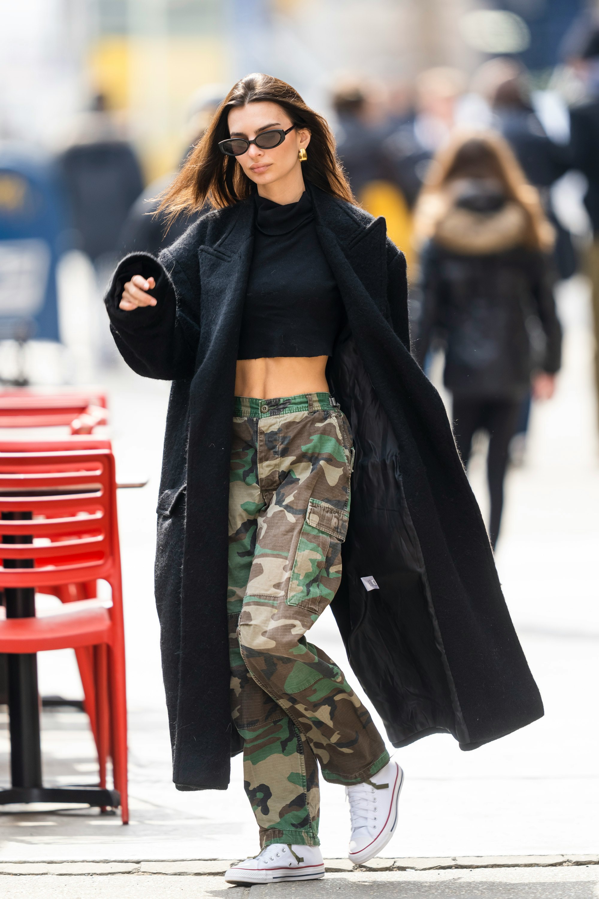 Emily Ratajkowski seen wearing a leather jacket and camo cargo pants during  a solo outing in