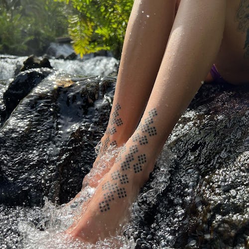 a foot tattoo by Mystic Tattooing