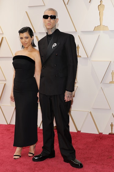 Kourtney Kardashian and Travis Barker attends the 94th Annual Academy Awards