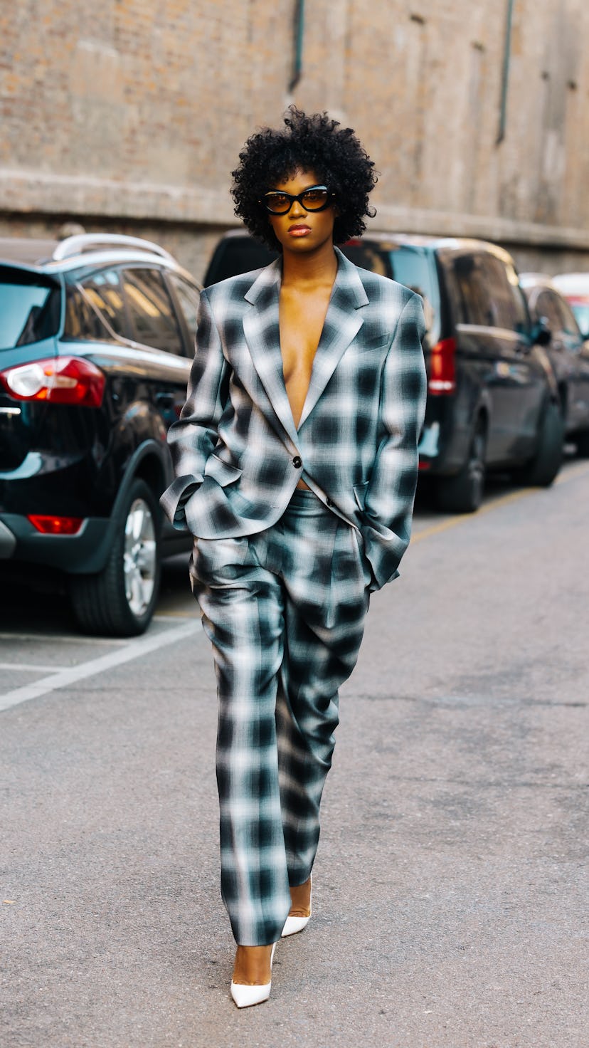 A guest wears a plaid outfit.