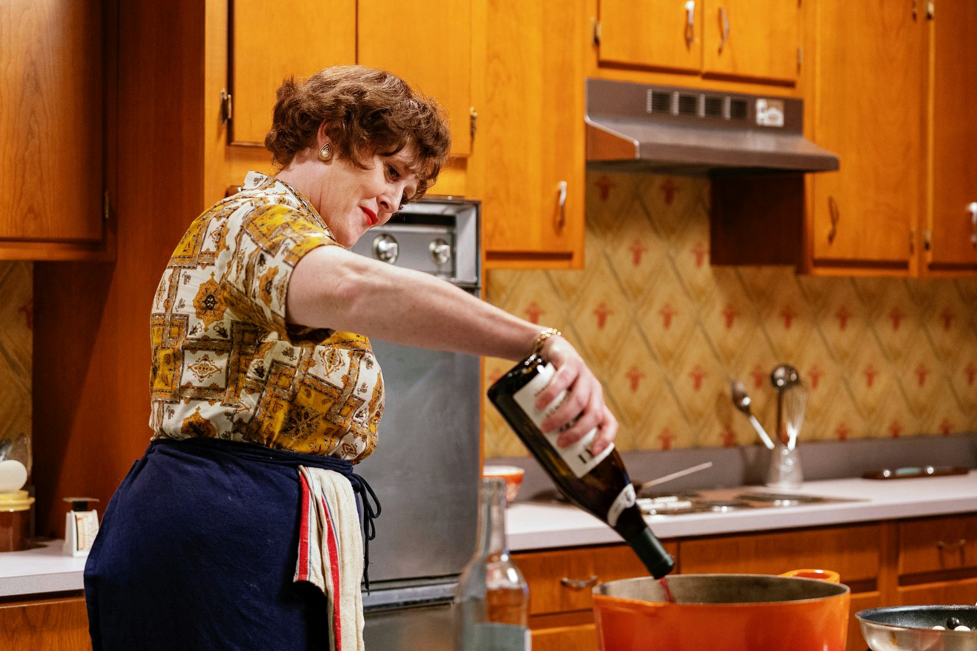 Sarah Lancashire as Julia Child cooking.
