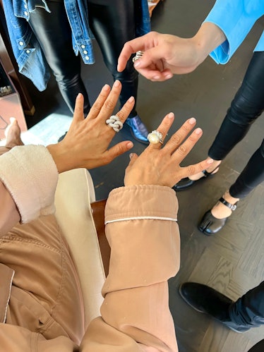 Rosie Perez showing off two rings on her hands
