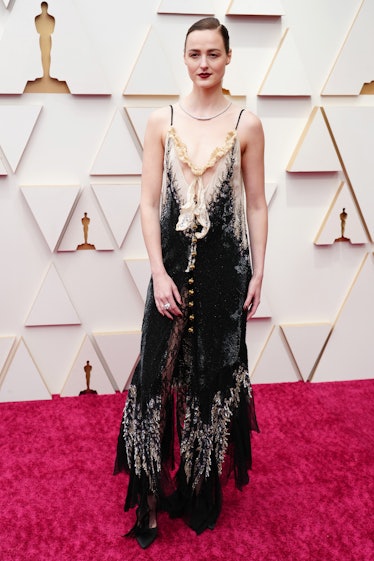 Renate Reinsve wearing a black open-shoulder Louis Vuitton dress at the 2022 Oscars