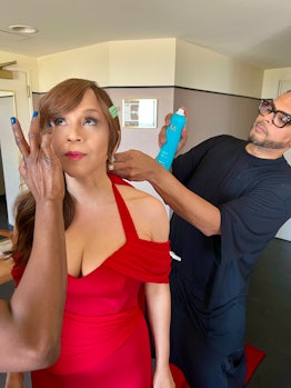 Rosie Perez getting her hair done by her hairstylist Johnny Lavoy for the 2022 Oscars