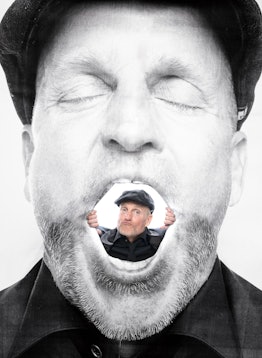 Woody Harrelson peeking out from an image of his face in a photo by JR
