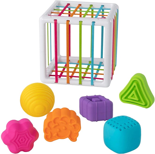 Product photo; cube with elastic bands and different shape blocks