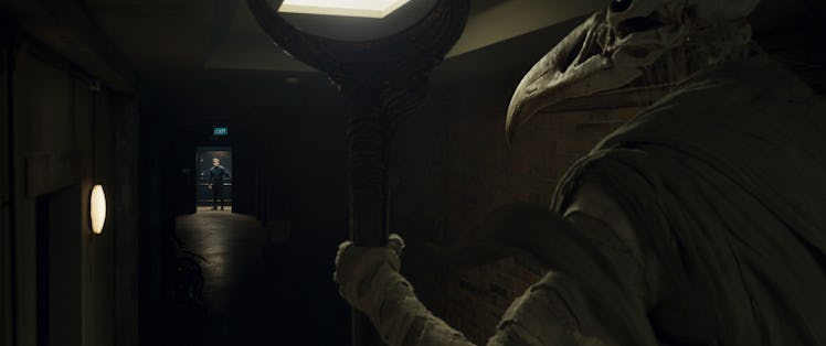 Khonshu looking down a hallway at Steven Grant (Oscar Isaac) in Moon Knight Episode 1