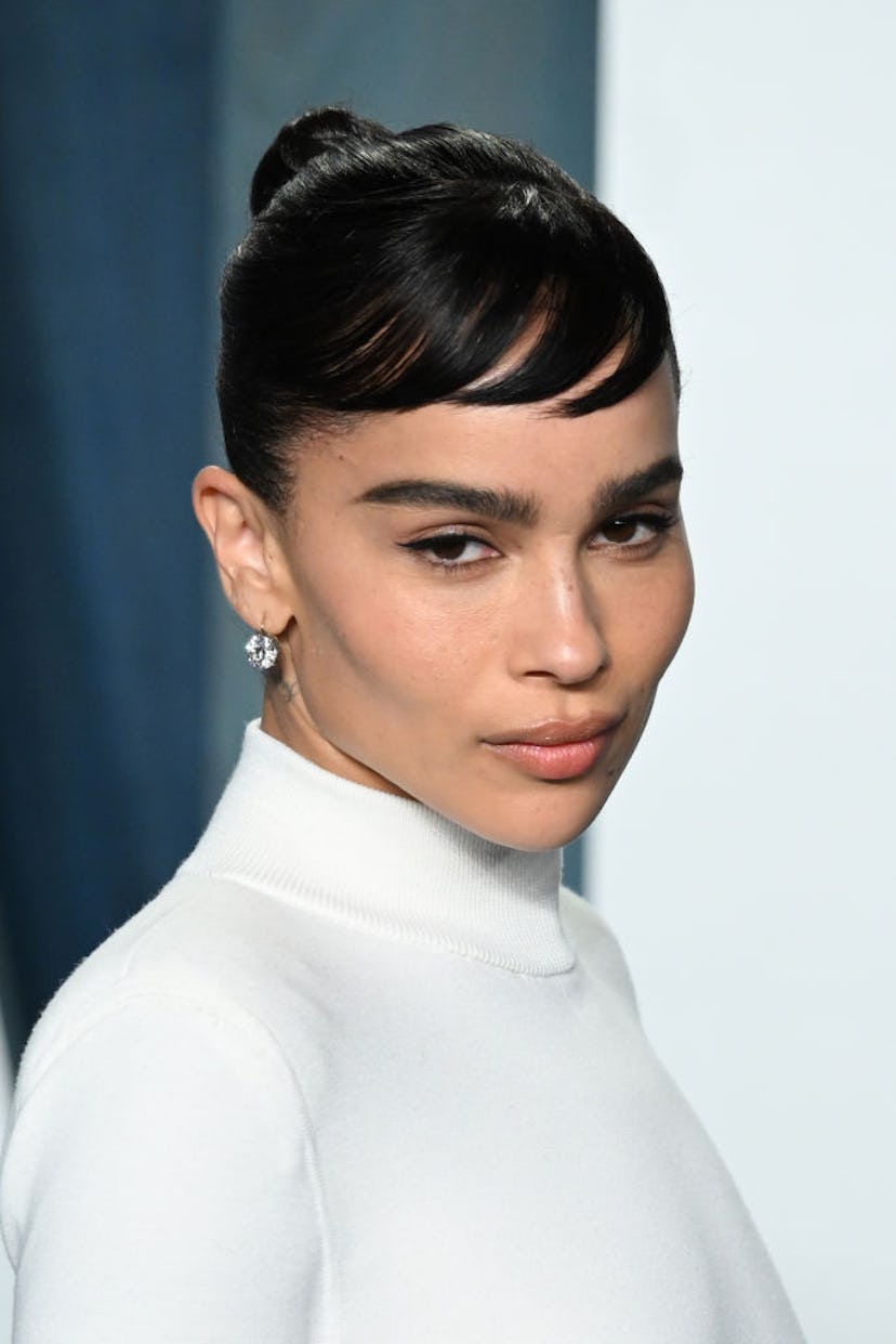 Spring 2022's hair trends include elevated topknots. 