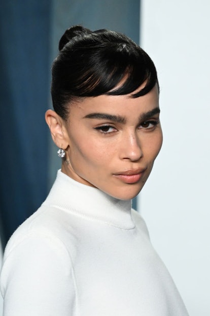 Spring 2022's hair trends include elevated topknots. 