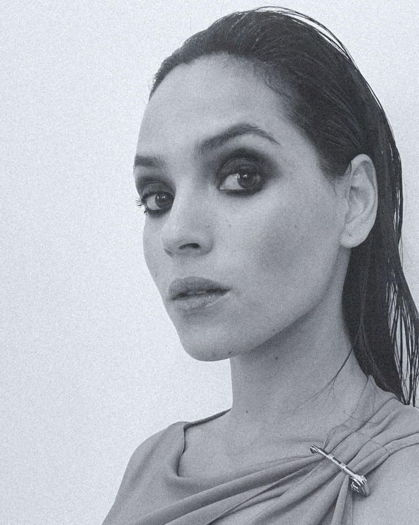 Adria Arjona posing for a photo