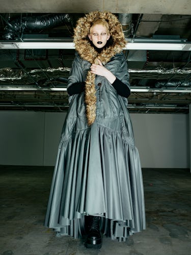 A gray coat and faux fur lined hoodie from Junya Watanabe