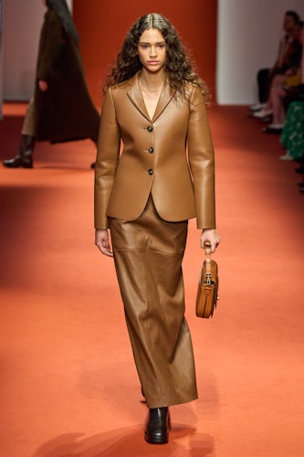 a model wearing brown leather at Tods