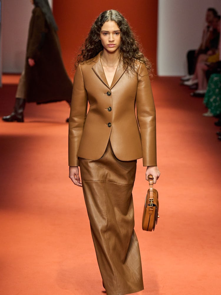 a model wearing brown leather at Tods