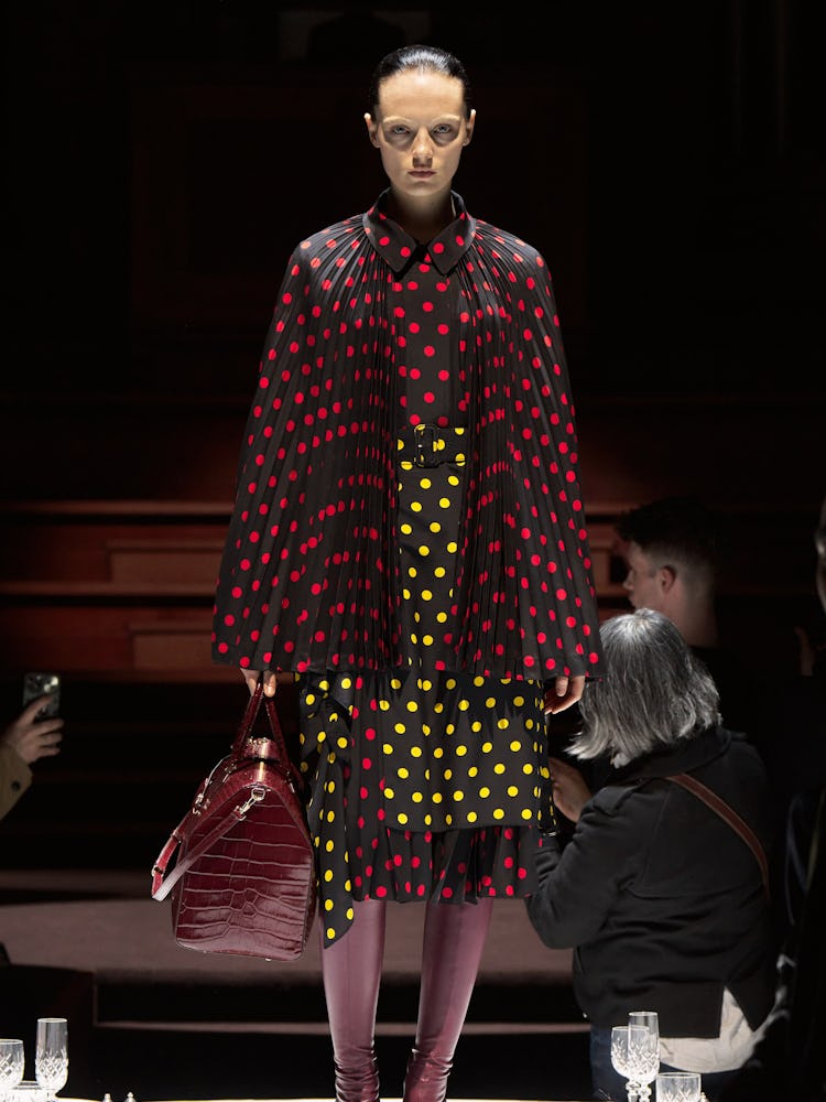 A model wearing Burberry's polka dot skirt and cape