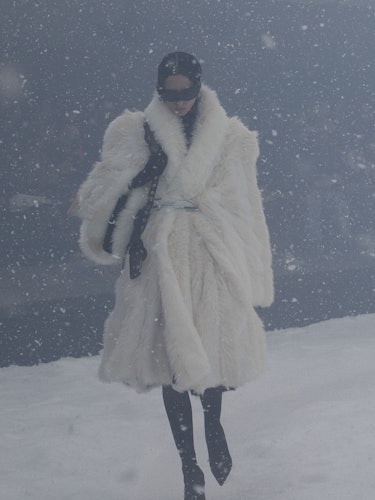 A model in a white Balenciaga fur coat