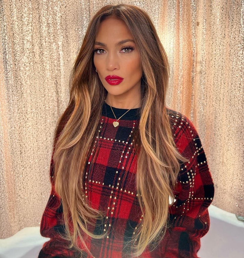 J. Lo wears her hair in long, face-framing layers.
