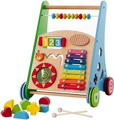 This wooden push walker has lots of activities attached for baby to play with.