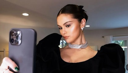 Selena Gomez wears BVLGARI earrings and necklace.