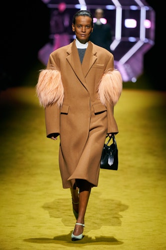Liya Kebede in a Prada camel coat at the brand's runway show