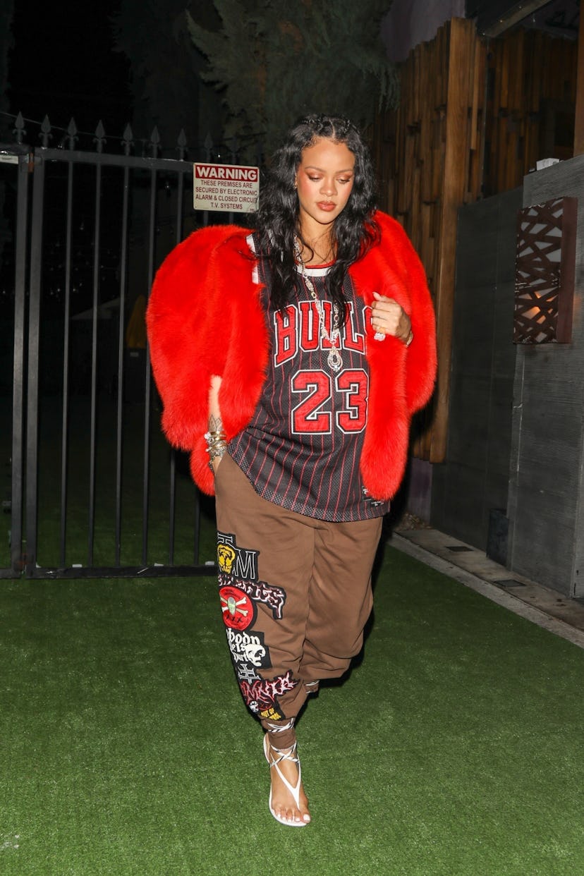 Pregnant Rihanna cuts a stylish figure in a Chicago Bulls jersey as she exits Nobu after dinner.