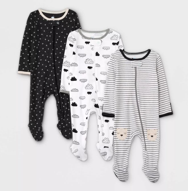 Three baby footie pajamas in black, white, and grey