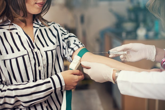 woman getting blood drawn for blood test for pregnancy