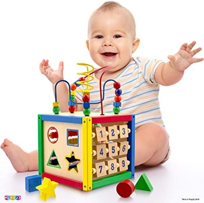 This wooden activity cube includes five toys in one.