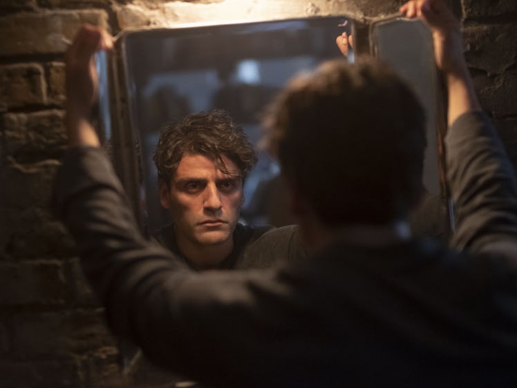 Oscar Isaac in Marvel's Moon Knight looing at a mirror