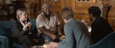 Four characters sitting and talking in The Bubble