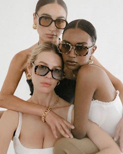 three models wearing oversize sunglasses