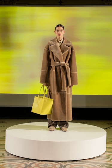 Model in beige shearling coat at Nanushka fall 2022