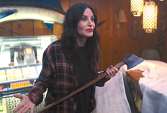 Courtney Cox as Pat holds an ax in 'Shining Vale.'