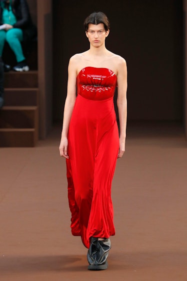 Model in red lips dress at Loewe fall 2022