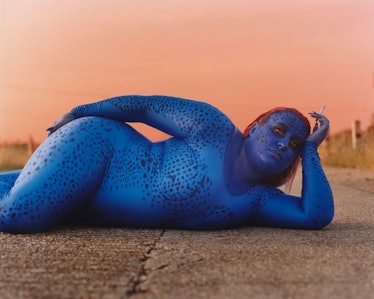 A woman lying on the road in a Mystique cosplay costume by photographer Thurstan Redding